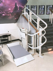 Wheelchair lift to ascend stairs in college lecture hall